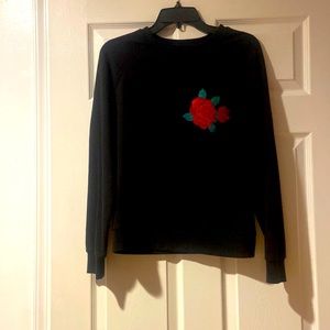 Black soft sweat shirt with glitter scales to make a flower